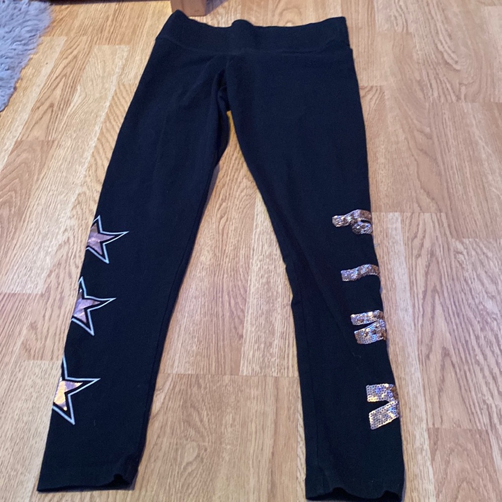 Leggings with shiny stars and and shiny logo on the side